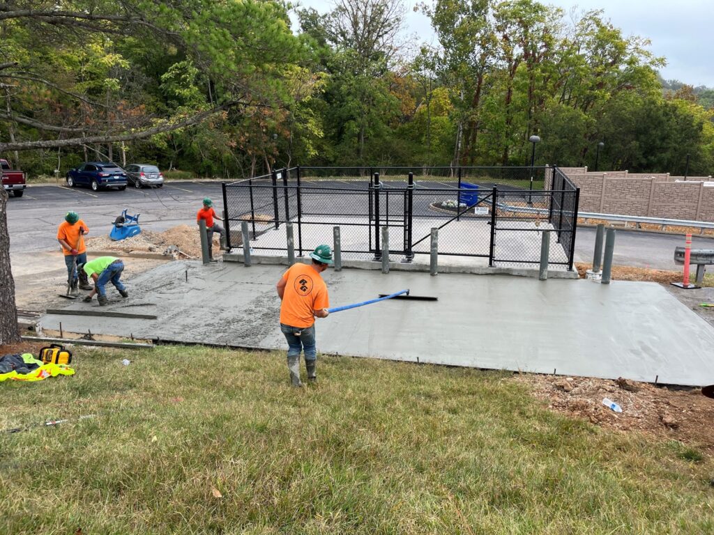 workers spreading concrete